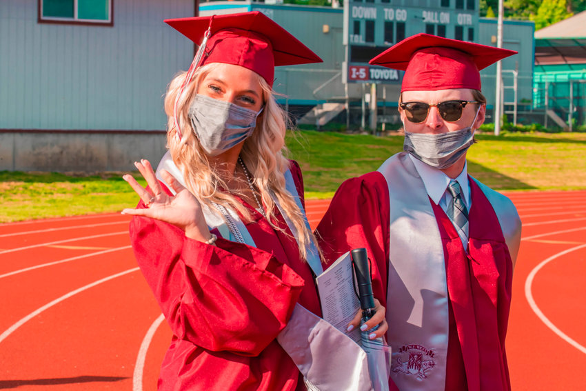 Bearcats walk across the track during a graduation ceremony on Saturday in Chehalis at Bearcat Stadium.