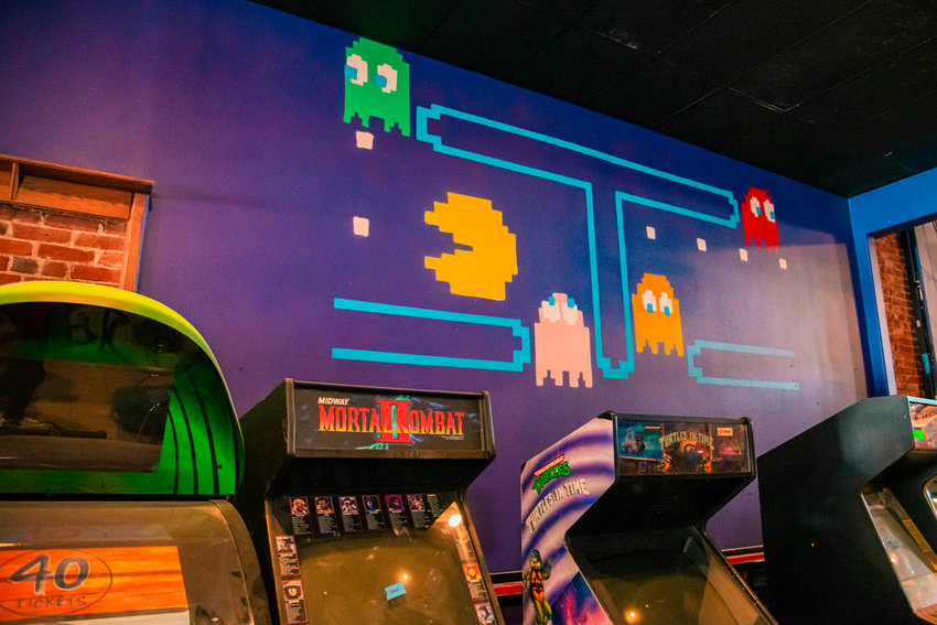 A Pac Man mural is displayed above arcade machines at Insert Coin in Centralia in this file photo from 2021.