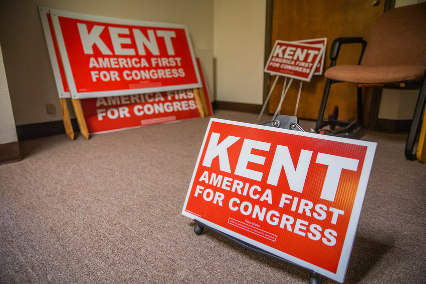 Signage for candidate Joe Kent sits on display in a Vancouver office building on Thursday.