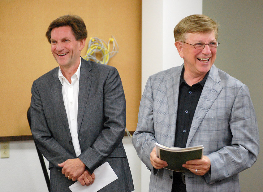 Kevin Smith, left, and Orin Smith react while being honored during a Chehalis Community Renaissance Team meeting in July 2013 in this Chronicle file photo.