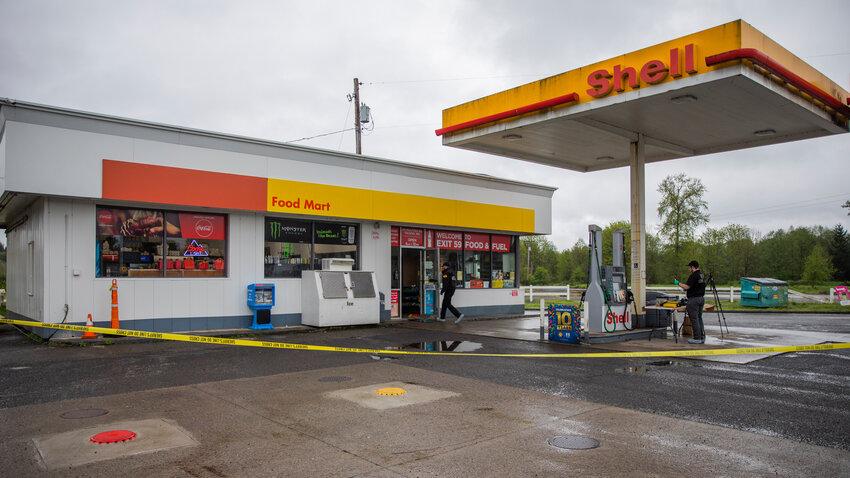 Crews from the Washington State Patrol crime lab, Lewis County Sheriff’s Office and the Lewis County Coroner's Office respond to a scene at the Shell gas station located along Mulford Road in Toledo while investigating a homicide on Thursday, May 4, 2023.