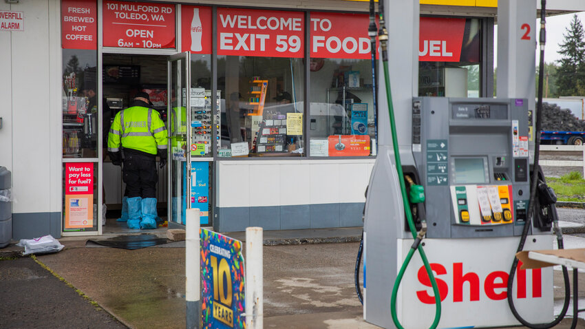The Lewis County Coroner's Office responds to the scene at the Shell gas station located along Mulford Road in Toledo while investigating a homicide on Thursday, May 4, 2023.