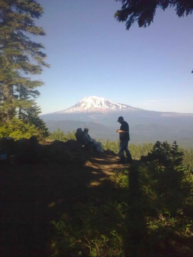 Aron Christensen is pictured on a hike with his father in this photo provided by his sister.