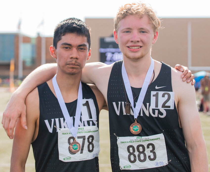Mossyrock’s Miguel Gomez and Huge Wedam smile with their medals after taking eighth and seventh place, respectively, in the 1B boys 3200 meter dash at the 1A/2B/1B State track championship in Yakima on Saturday, May 27.