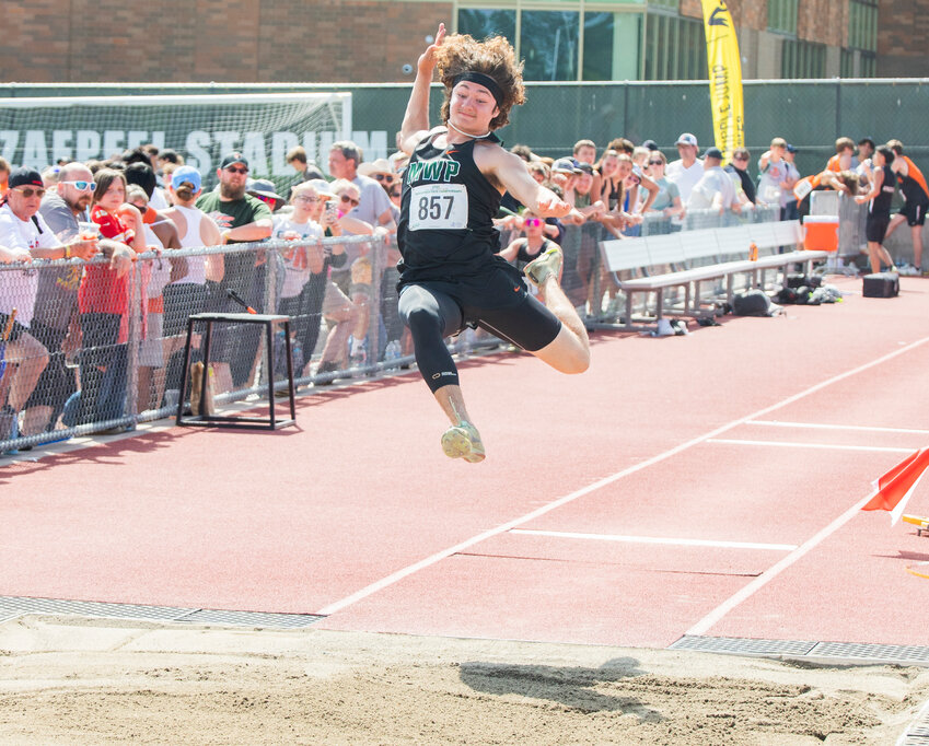 Morton-White Pass athlete Max Lowe soars through the air during the 2B boys State long jump competition in Yakima on Friday, May 26. Lowe earned fourth place for his performance.
