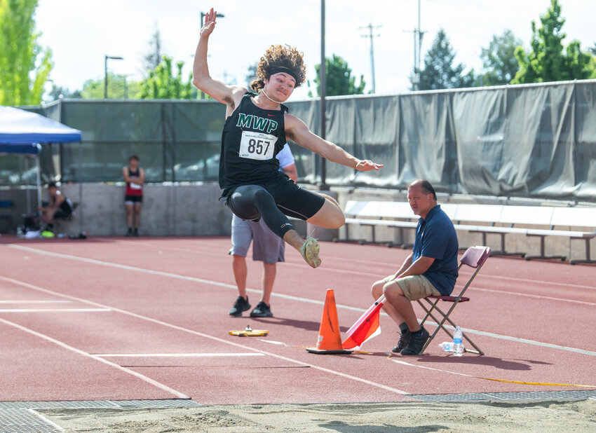 Morton-White Pass athlete Max Lowe soars through the air during the 2B boys State long jump finals in Yakima on Friday, May 26. Lowe earned fourth place for his performance.