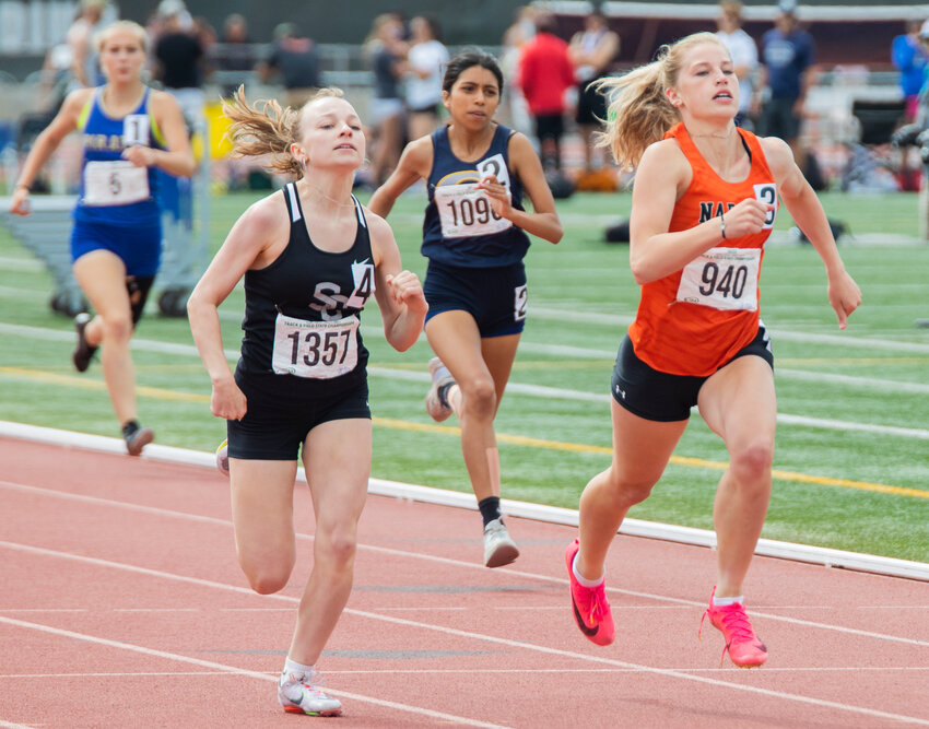 Napavine’s Morgan Hamilton pulls into second place during the 2B girl 200 meter dash State finals in Yakima on Saturday, May 27.