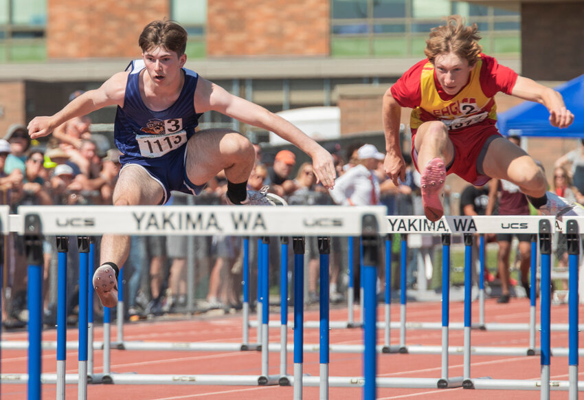 Pe Ell’s second place 100 meter hurdler Carter Phelps flies through the air at the State track and field meet in Yakima on Saturday, May 27.