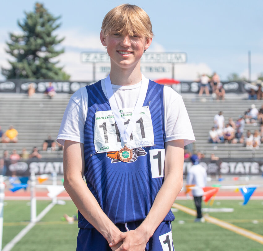 Pe Ell’s eighth place 100 meter hurdler Calan McCarty smiles for a photo with his medal at the State track and field meet in Yakima on Saturday, May 27.