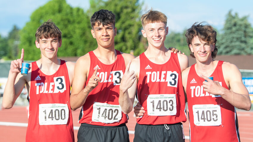 From left, Toledo’s 4x400 relay team Trevin Gale, Jordan McKenzie, Conner Olmstead and John Rose smile for a photo together as tears stain their cheeks moments after winning the 2B State championship during the track and field meet in Yakima on Saturday.