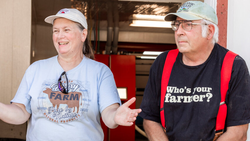 Linda and Andy Styger smile while talking about their cows and dairy farming in the Chehalis Valley on Monday. July 31.