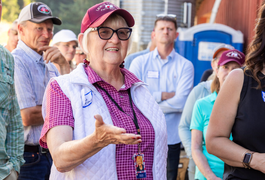 Edna Fund smiles while asking questions about the Styger Family Dairy during a Lewis County Farm Bureau tour on Monday, July 31.