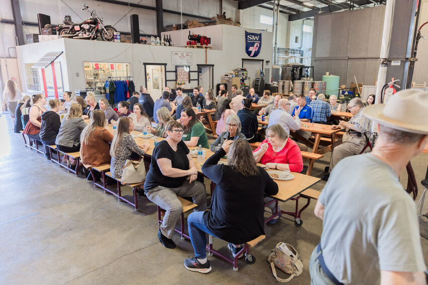 Attendees mingle and munch during an event hosted by the Centralia-Chehalis Chamber of Commerce at Dick’s Brewing on Thursday, Sept. 14, in Centralia.