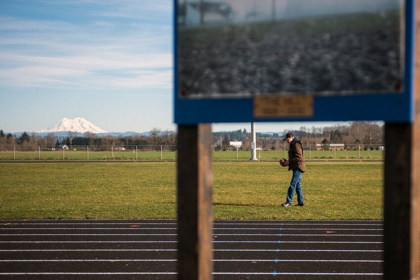 Warren Robertson walks on the Adna High School football field as he prepares to show off his punting prowess on Feb. 9, 2016.