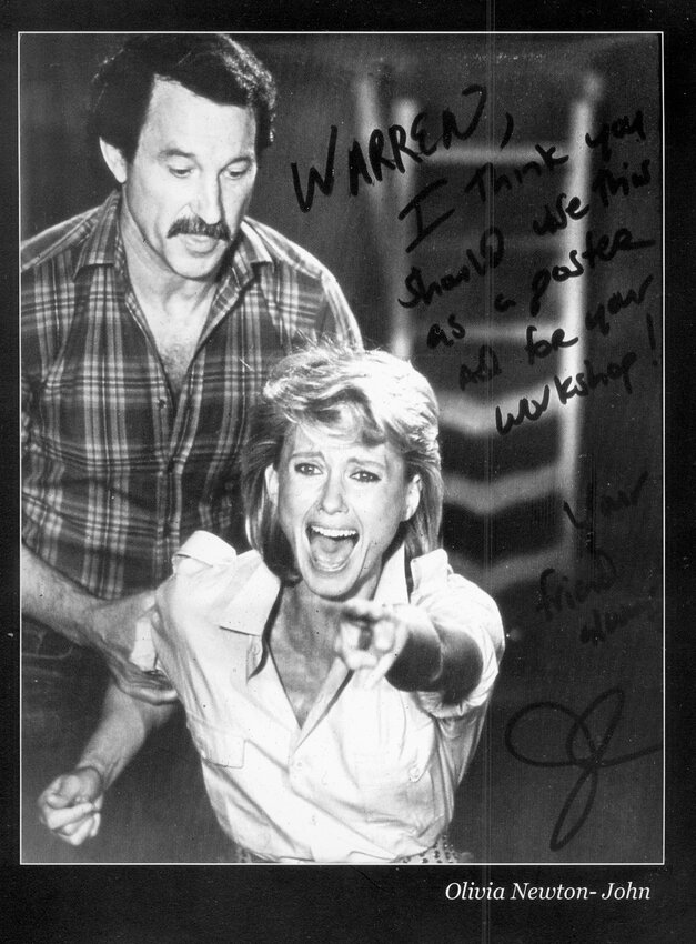 Olivia Newton-John reacts during a a scene with Warren Robertson in the film "Two of a Kind," which featured Robertson playing the role of himself. In addition to Newton-John, John Travolta also starred in the film.