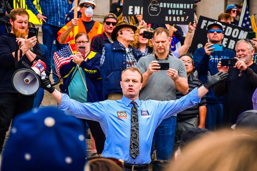 Tim Eyman speaks at a protest at the Capitol in April.&nbsp;