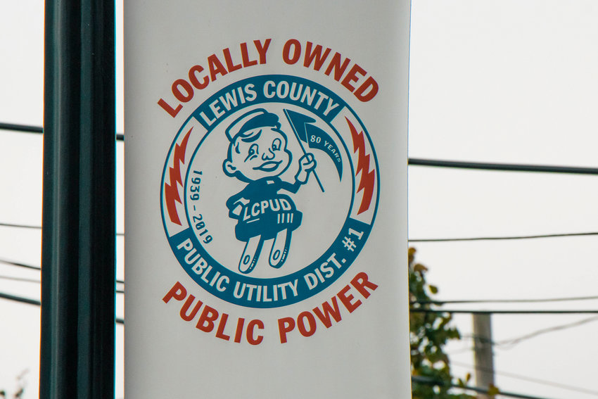 A Lewis County P.U.D sign hangs on display in Chehalis on Tuesday.