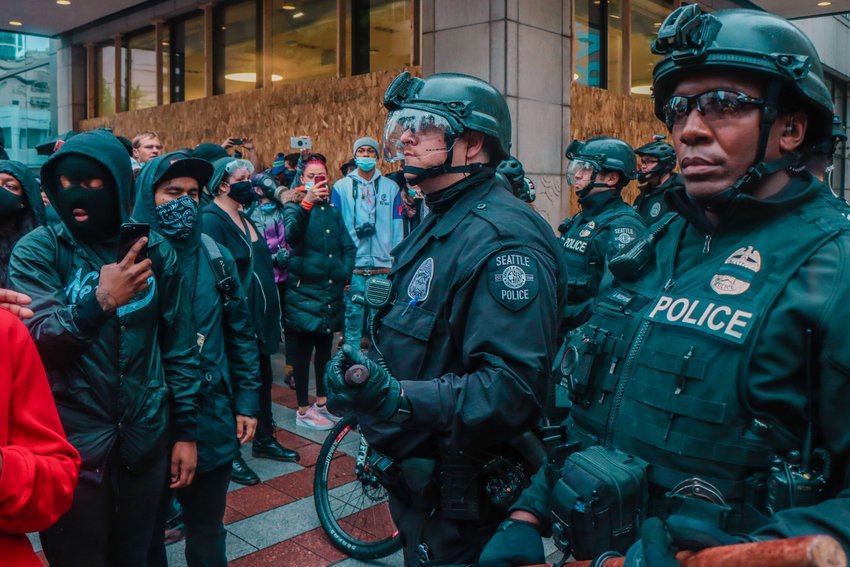 Protesters meet police during marches in Seattle in late May.