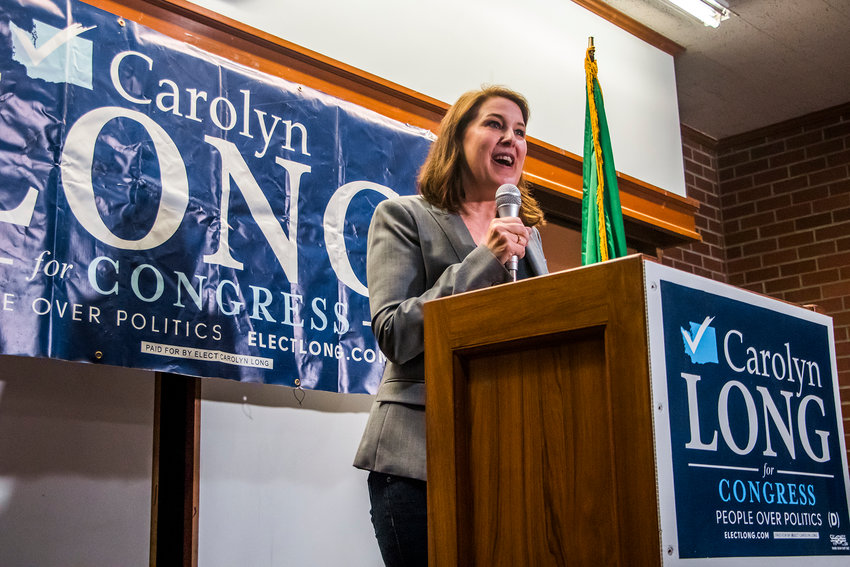 Carolyn Long talks to attendees during a campaign rally in July 2019 at the Centralia Timberland Library.