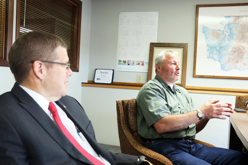 2017 FILE PHOTO &mdash; Dan Rich, president of the Centralia Community Foundation, discusses the partnership it has created with the Centralia School District in order to receive a $2 million grant from TransAlta, while Jonathan Meyer, secretary of the foundation and Lewis County prosecutor, looks on.