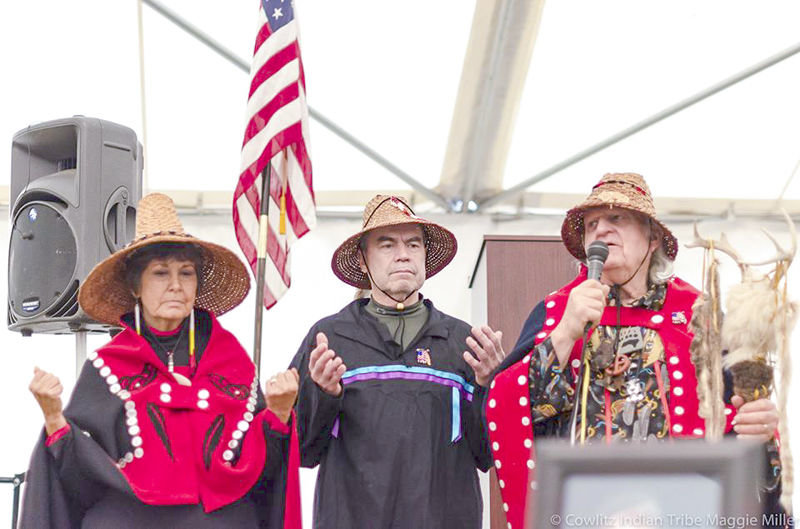 FILE PHOTO — Cowlitz Indian Tribe chairman Bill Iyall, center, stands with two of his tribe’s spiritual leaders, Tanna Engdahl, left, and Roy Wilson, right, at a gathering on the tribe’s new reservation land near La Center in late December 2014.