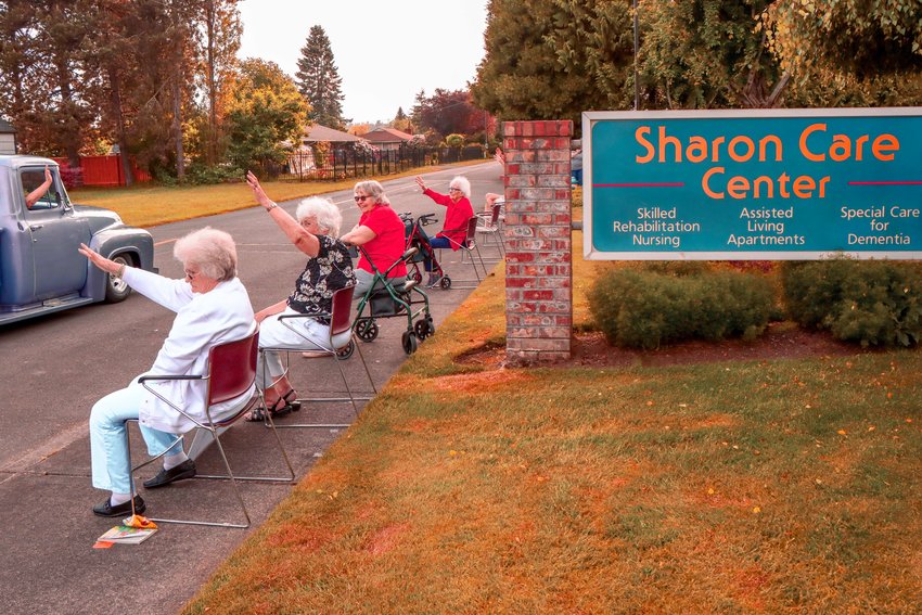 Sharon Care residents wave to passing vehicles in this 2020 Chronicle file photo.