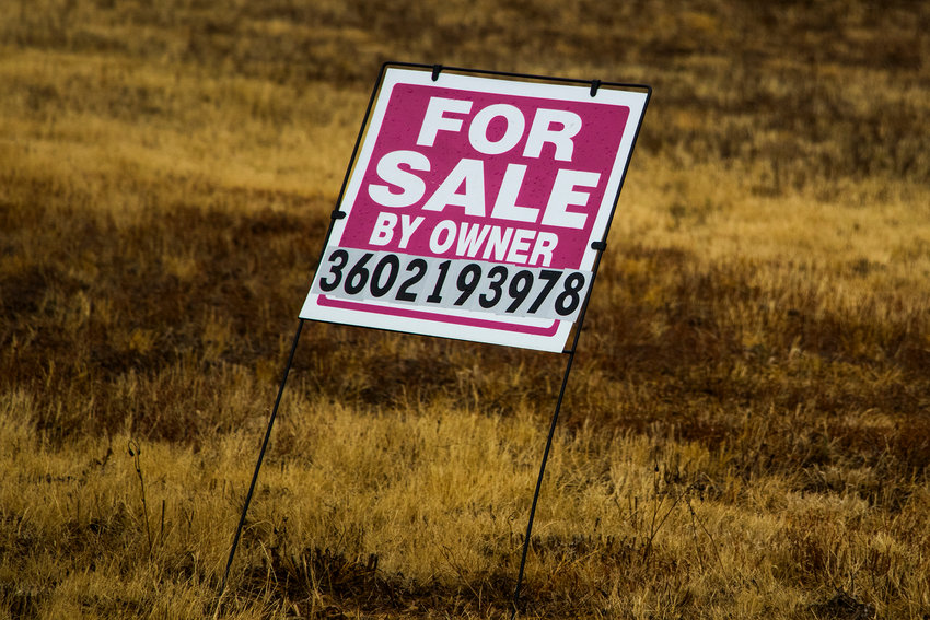 A 'For Sale' sign is seen in a lot in Centralia in this Chronicle file photo.