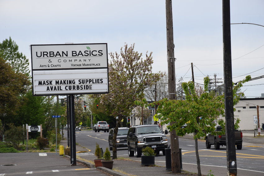 Urban Basics and Company advertises for mask-making supplies on its streetside sign April 26.