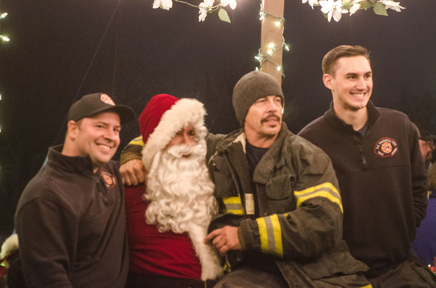 First responders with Southeast Thurston Fire Authority are pictured with Santa Claus at a prior Holiday in the Park event in Rainier.