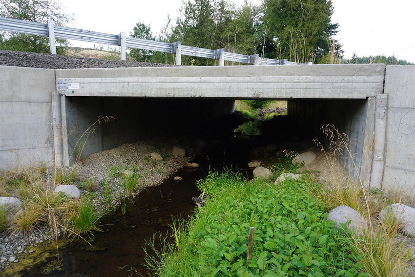 Prairie Creek flows under a new culvert on Bunker Creek Road in this 2019 Chronicle file photo.