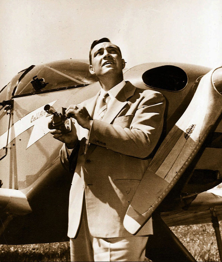 FILE - In this 1947, file photo, Kenneth Arnold, holds a movie camera in front of his CallAir, after he reported seeing nine alleged UFOs near Mount Rainier, Wash. Arnold had no idea he would change the world when he told reporters in Pendleton he saw nine strange objects flying along the Cascades. But 70 years ago June 25, that&rsquo;s what he did. (Idaho Statesman, File)