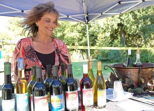 Tenino&rsquo;s Scatter Creek Winery co-owner Andrea Keary offers some of her award-winning wines in this file photo.