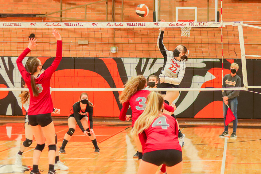 Centralia's Tatum Johnston (22) hits the ball over the net during a Swamp Cup game against W.F. West Tuesday night.