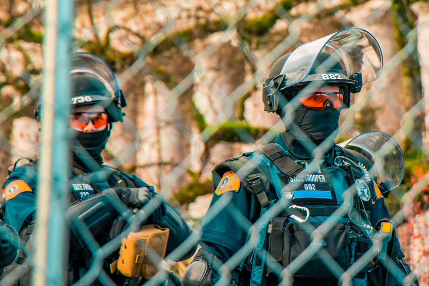 State Troopers sport tactical gear during a rally in Olympia outside the Washington state Capitol building in early January.&nbsp;
