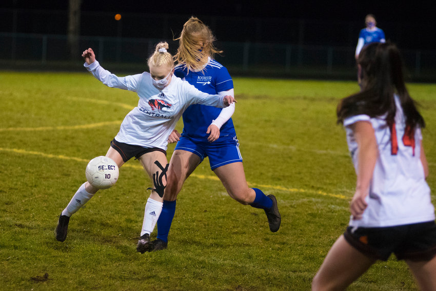 Centralia's Taylor Smith fights for possession with Rochester's Staysha Fluetsch on Tuesday.