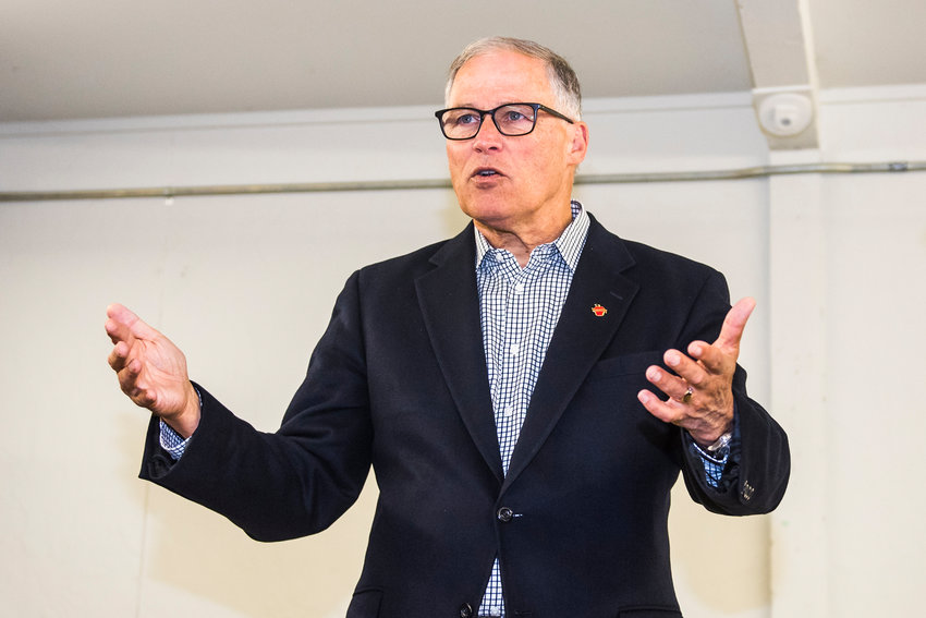FILE PHOTO &mdash; Gov. Jay Inslee talks during a tour of the cold weather shelter in November 2019 at the Southwest Washington Fairgrounds in Chehalis.