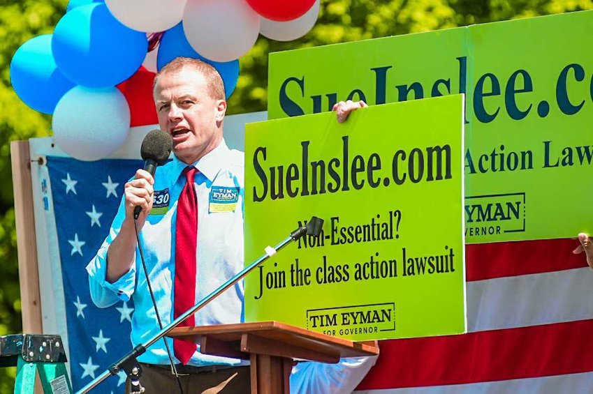 Tim Eyman addresses a crowd during a protest at the Capitol in early May.&nbsp;&nbsp;