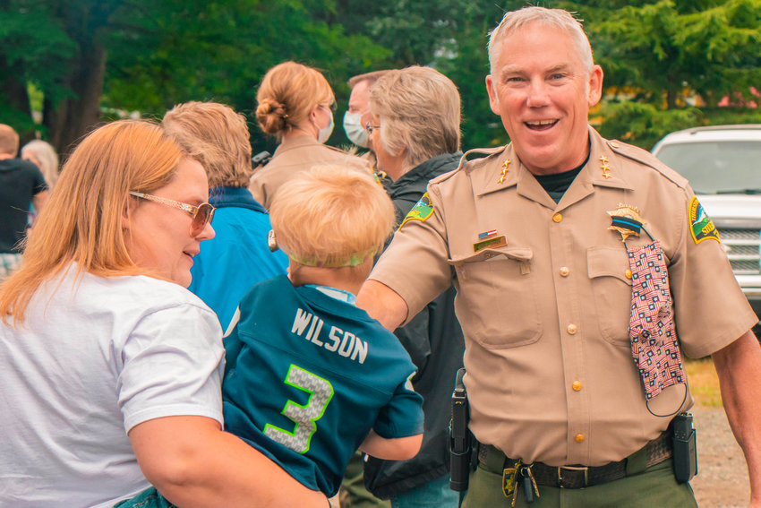 FILE PHOTO &mdash; Thurston County Sheriff John Snaza smiles as he greets attendees of a Blue Lives Matter rally in Rochester.