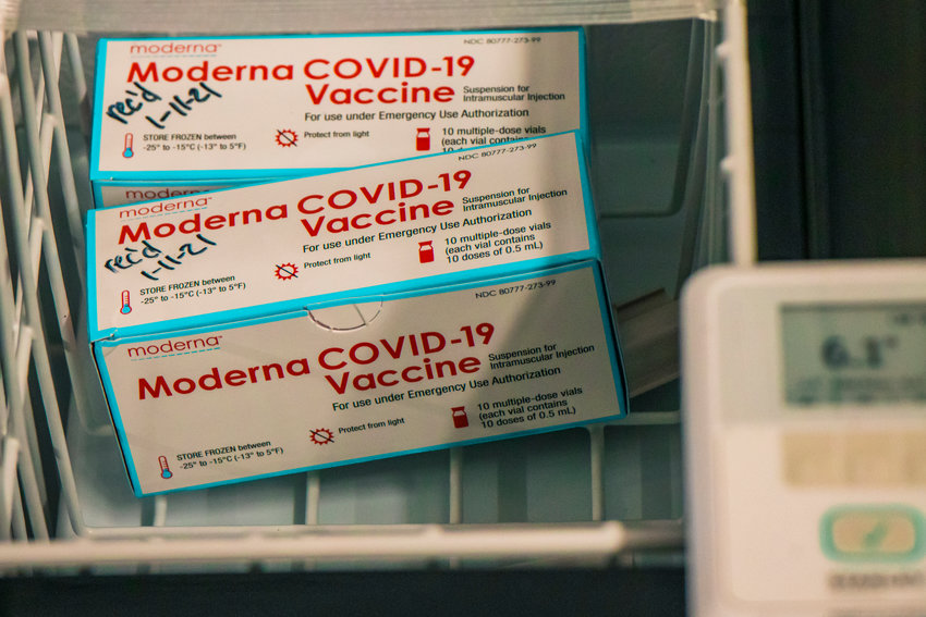 Moderna COVID-19 vaccine vials are kept inside a cooler inside the Community Event Building at the Southwest Washington Fairgrounds during a vaccine distribution in late January.