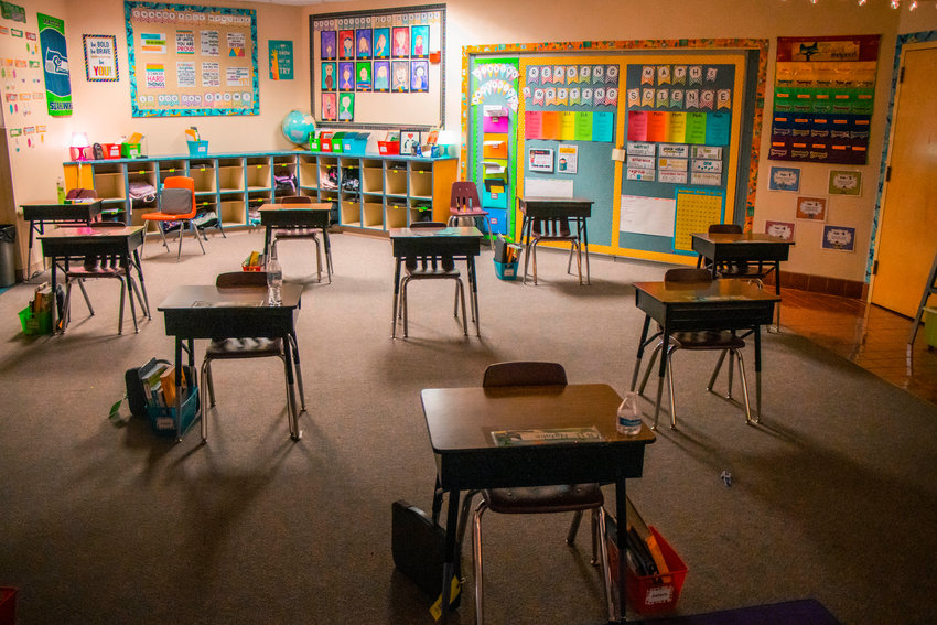FILE PHOTO &mdash; Desks are separated by six feet to help prevent the spread of COVID-19 at Winlock Miller Elementary School in this photo taken earlier this year.