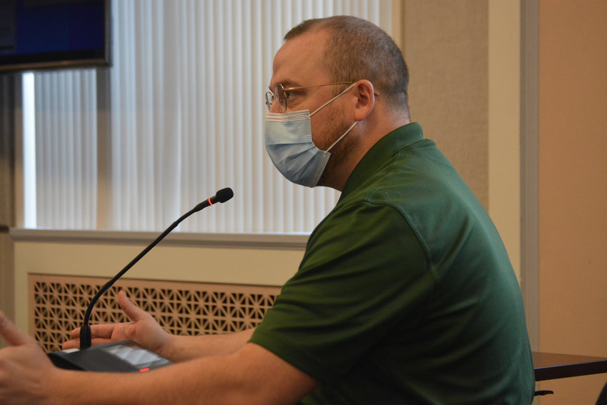 FILE PHOTO &mdash;&nbsp;Lewis County Public Health Director J.P. Anderson announces policies in how the county will publicly report COVID-19 cases in a meeting last year.