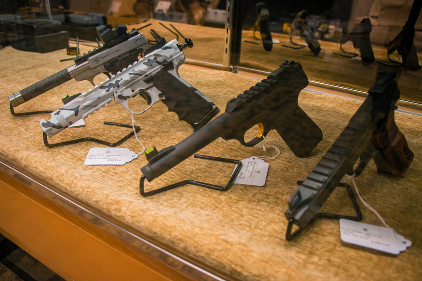 Handguns are on display inside Castle Guard Sports in this Chronicle file photo.