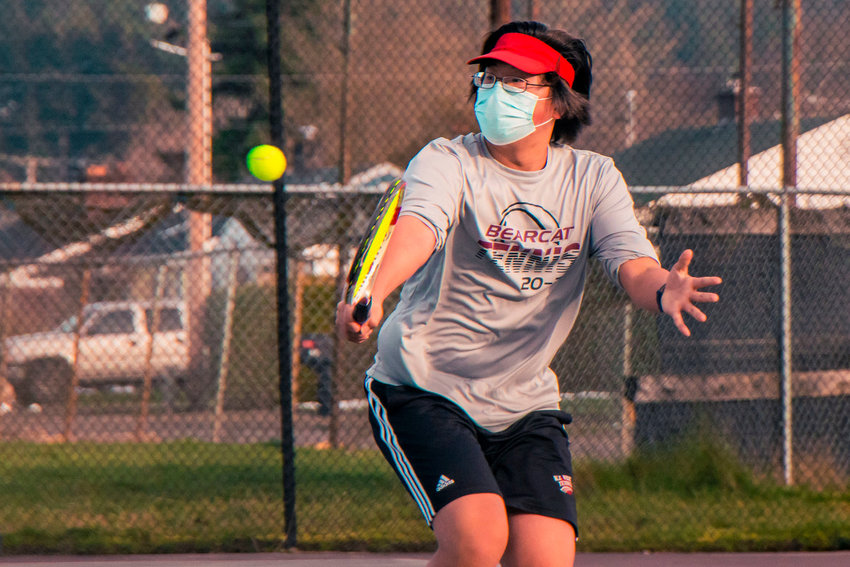 FILE PHOTO: Justin Chung makes contact during a match in Chehalis on Feb. 17.