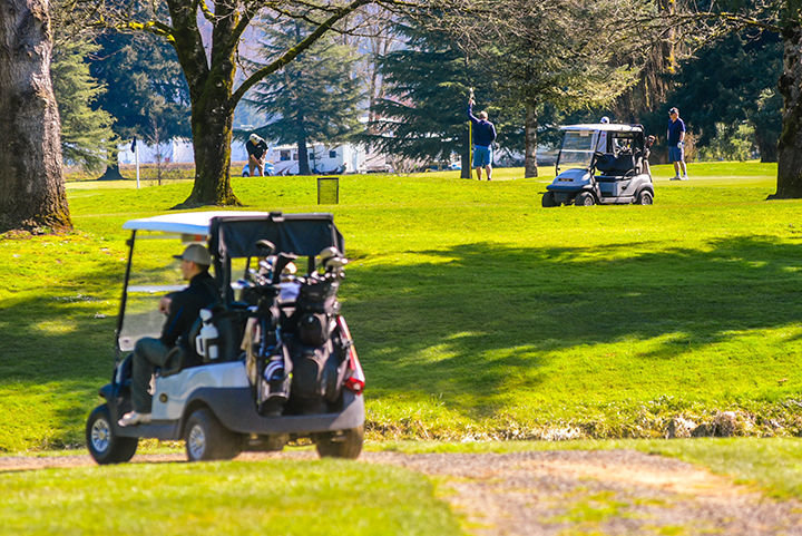 FILE PHOTO: Carts and golfers line the grass as Riverside Golf Course in March 2020.
