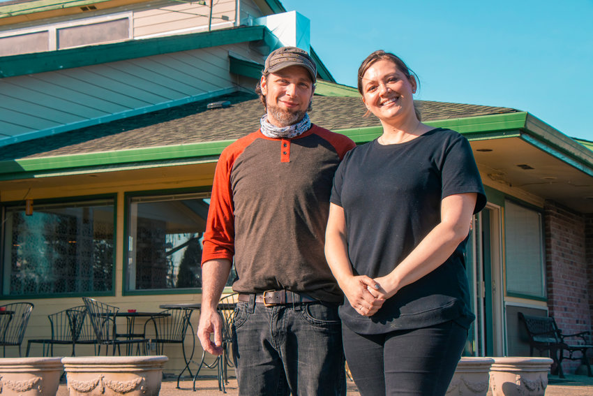 Sam and Amy Messina pose for a photo outside the Grill on the Green Thursday afternoon in Chehalis.