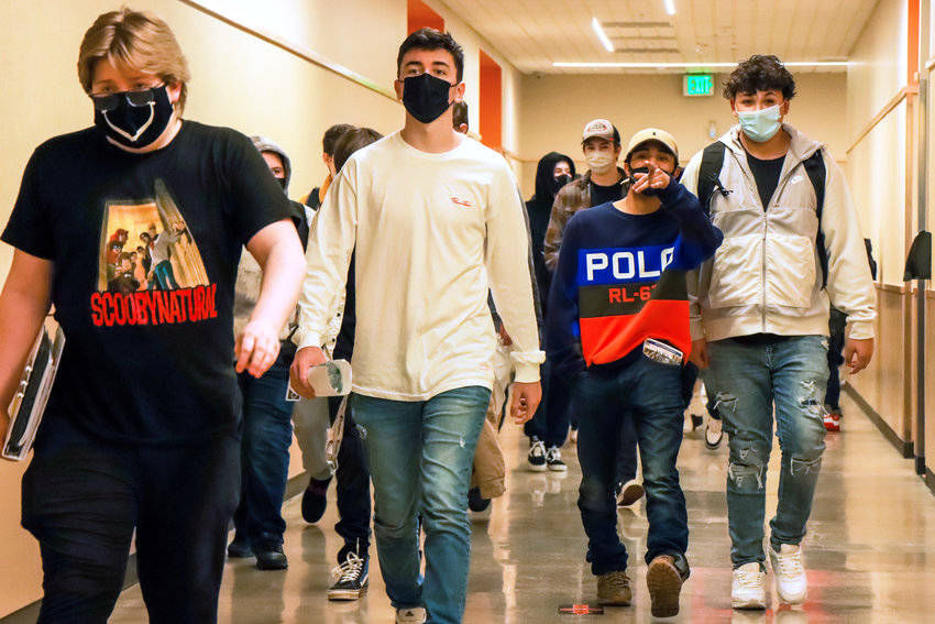 Students sport masks as they walk to their classes during their first week back in school last March.