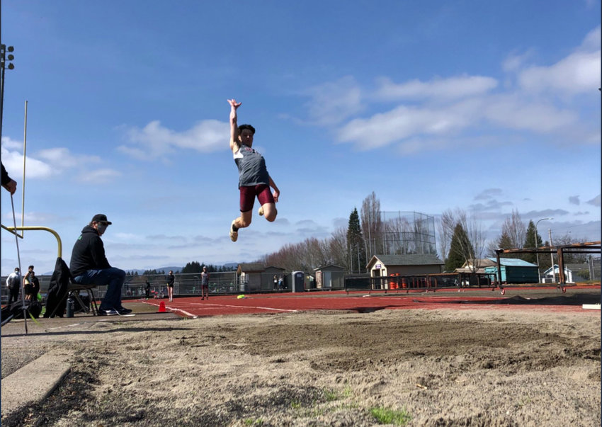 W.F. West&rsquo;s Seth Hoff launches into the long jump pit on Saturday in Tumwater. Hoff won three events, including the long jump, with a leap of 19-05.50.