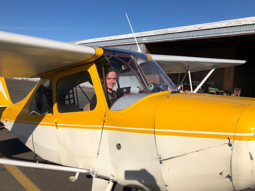 Sam Rinker is seen behind the controls of his 1946 Aeronca Champ.