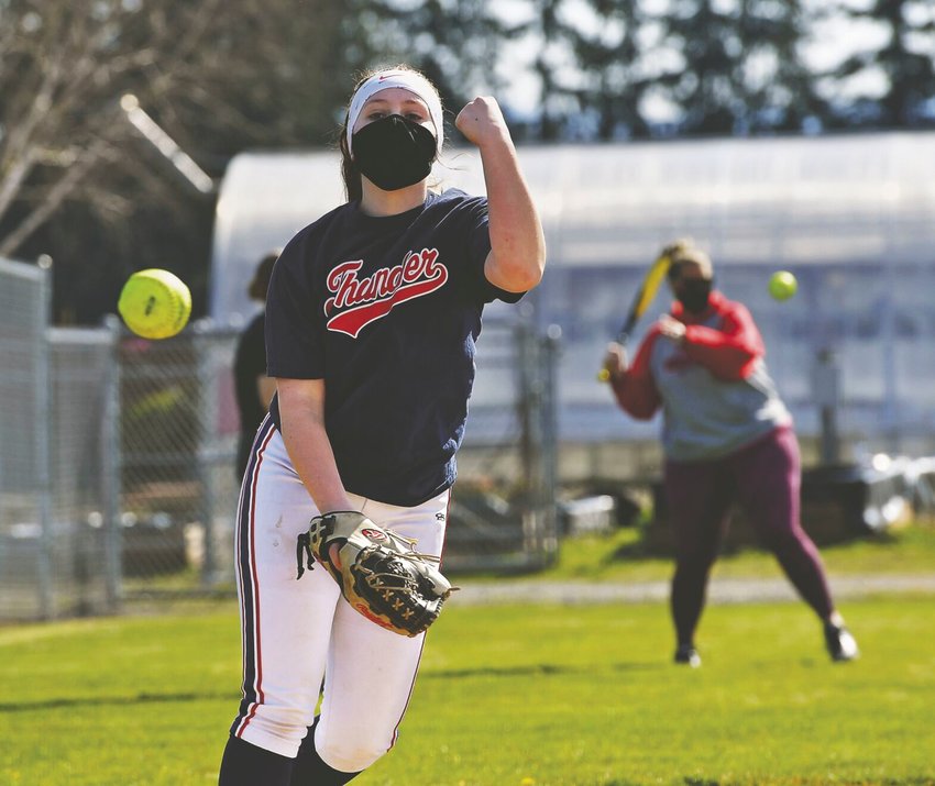 Yelm High School softball pitcher Vivian Watts, a junior, pitches to a teammate during practice on Wednesday, March 17.