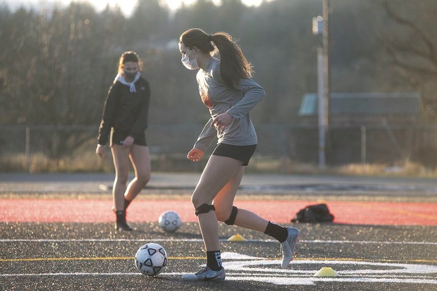 Tenino&rsquo;s Ashley Schow dribbles the ball during soccer practice Thursday.